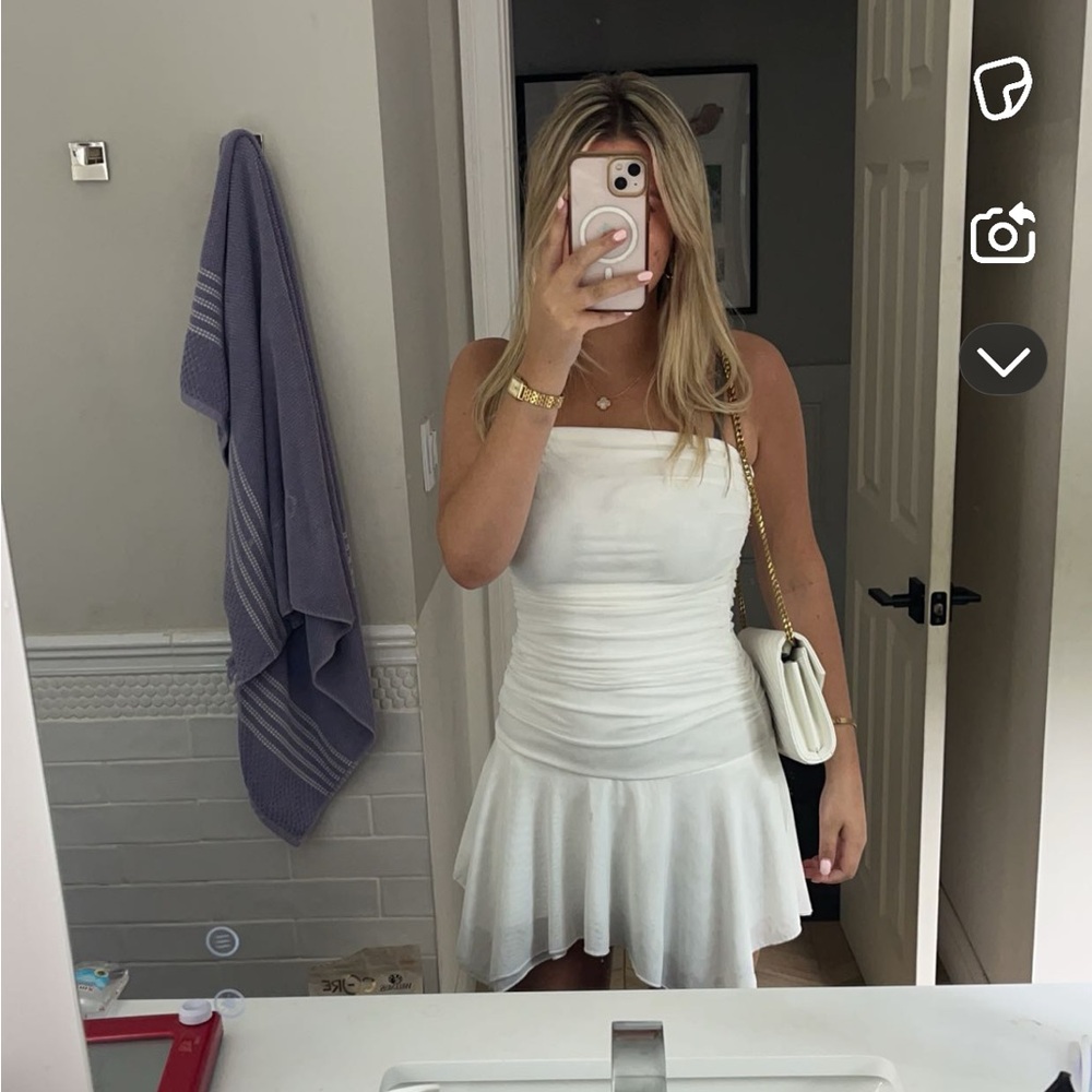 Boutique white dress, sleeveless with ruffle/flowey bottem perfect for summer